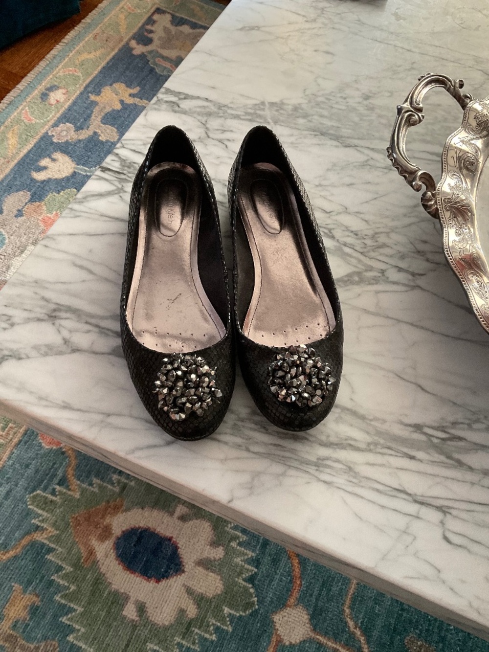 Pair of Calvin Klein faux black snakeskin flats with jewelled tow detail, 8m
